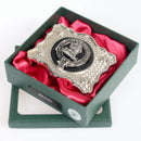 Home / Hume Pewter Clan Crest Buckle For Kilt Belts showcasing the intricate design and craftsmanship of the clan crest on a leather pad.