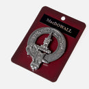 MacDowal Clan Crest Badge in Pewter shown on a soft fabric background, highlighting its intricate design and classic emblem for clan gatherings.
