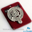 Urquhart Clan Crest Badge in Pewter, showcasing a detailed design with a traditional belted clansman belt, ideal for wear as a cap badge or brooch pin.